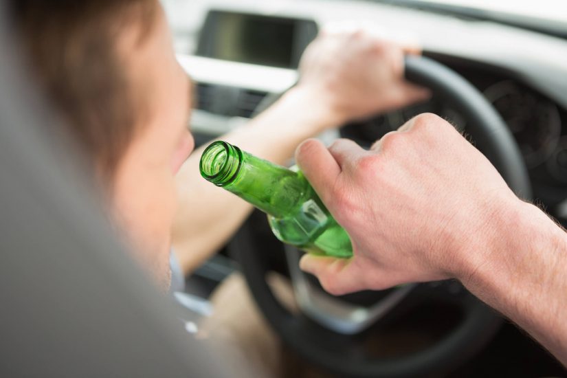 Photo of driver drinking while driving